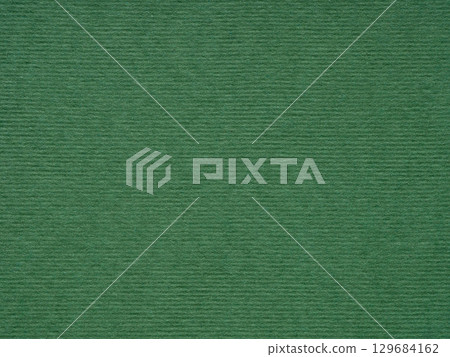 A serene green expanse, the paper's texture offers a moment of tranquility and a touch of nature 129684162