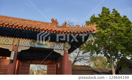 Traditional Chinese pavilion with intricate roof design in Jingshan park in Beijing, China Traditional Chinese pavilion with intricate roof design in Jingshan park in Beijing, China 129684199