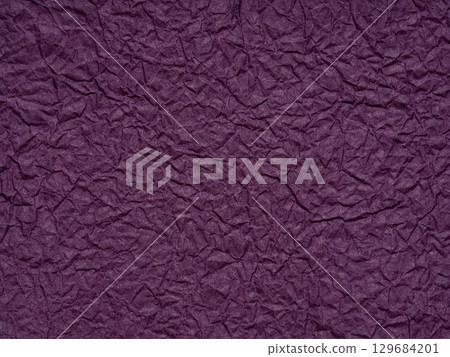 Deep purple crumpled paper texture whispers of mystery and creativity with its rich, royal vibe 129684201