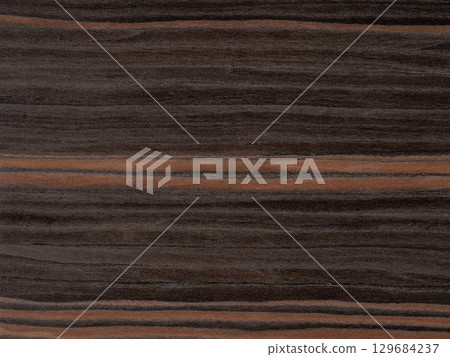 Earthy walnut whispers and warm cinnamon streaks meld in the rich tapestry of this elegant rosewood veneer 129684237