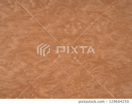 The warmth of cinnamon swirls across this cherry wood veneer, highlighting the intricate patterns nature can compose 129684250