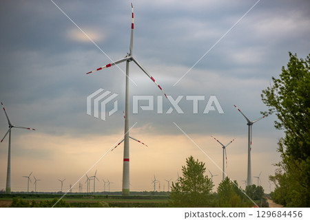 Wind Turbines in a Green Field Wind Turbines in a Green Field 129684456