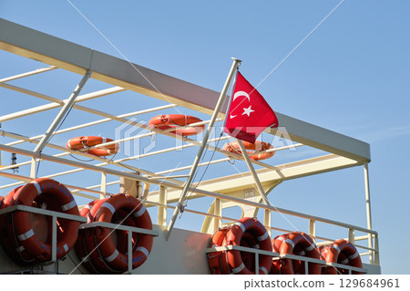 Turkish Flag on Ship with Life buoys Turkish Flag on Ship with Life buoys 129684961