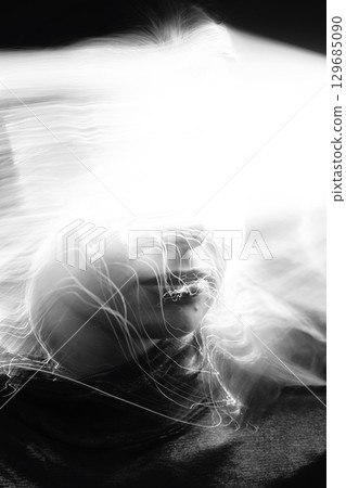 Abstract woman studio portrait with light painting technique 129685090