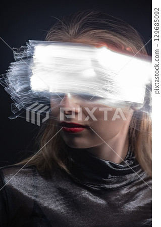 Abstract woman studio portrait with light painting technique 129685092
