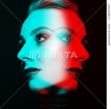 Close-up studio portrait of woman with fancy make-up in RGB color split effect style Close-up studio portrait of woman with fancy make-up in RGB color split effect style 129685097