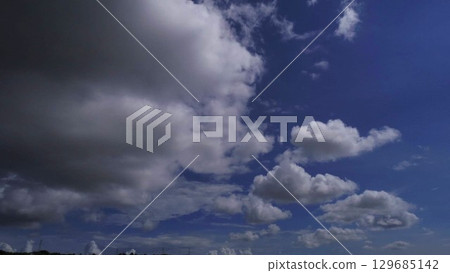 A dynamic summer sky spreads over the city of Okinawa A dynamic summer sky spreads over the city of Okinawa 129685142