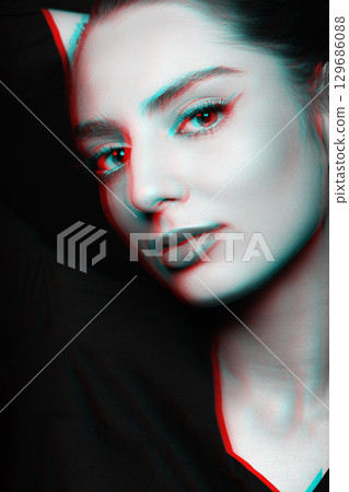 Beautiful woman with make-up close-up studio portrait in RGB color split effect style Beautiful woman with make-up close-up studio portrait in RGB color split effect style 129686088