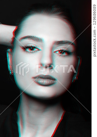 Beautiful woman with make-up close-up studio portrait in RGB color split effect style 129686089