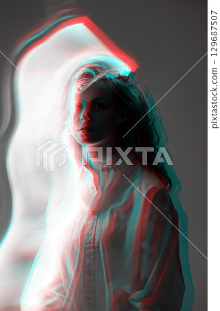 Abstract woman studio portrait with light painting technique in RGB color split effect style 129687507