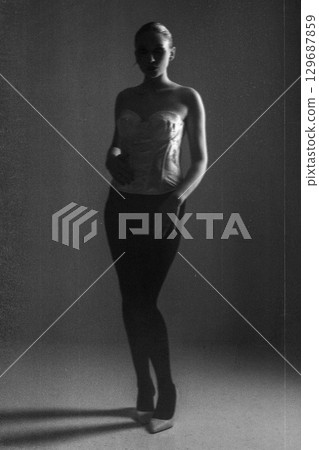 Beautiful dark woman portrait full body silhouette in grunge retro vintage style 129687859