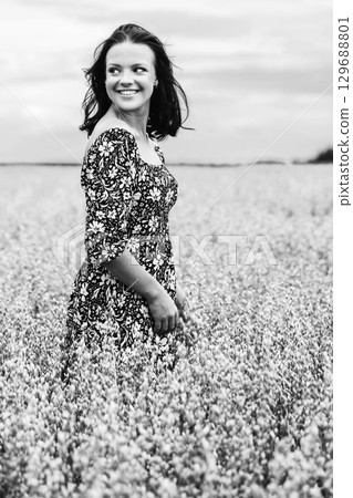 Smiling Woman in Wheat Field 129688801