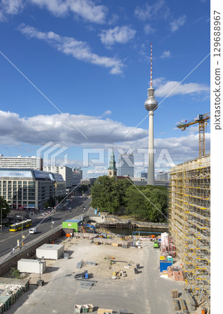 Berlin, Germany - July 01, 2018: Building of the City Palace in Berlin on the background of a TV tower. 129688967
