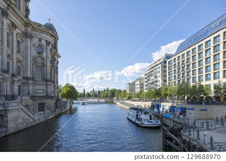 Berlin, Germany - July 01, 2018: View of the river Spree and the embankment of Berlin. 129688970