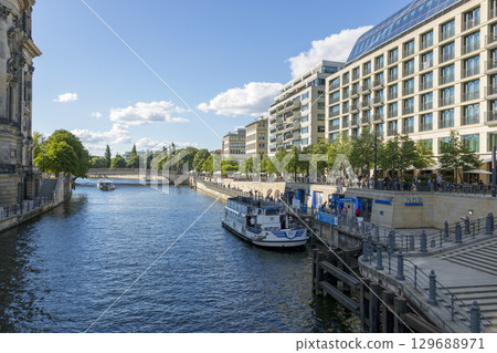 Berlin, Germany - July 01, 2018: View of the river Spree and the embankment of Berlin. Berlin, Germany - July 01, 2018: View of the river Spree and the embankment of Berlin. 129688971