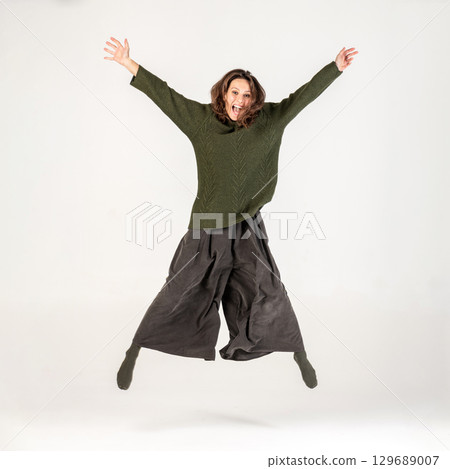 Woman Jumping in Air 129689007