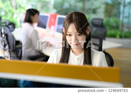 Woman working in a stylish office Woman working in a stylish office 129689783