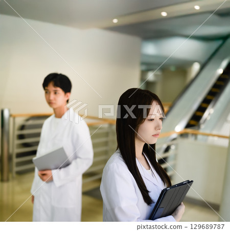 Portrait of a person wearing a white coat Portrait of a person wearing a white coat 129689787