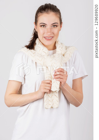 Woman portrait with white shirt and sweater 129689920