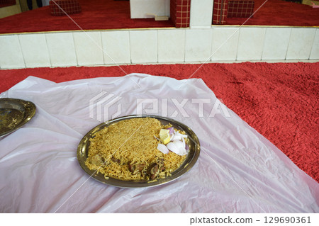 Eating camel meat kabsa at a local restaurant in Saudi Arabia Eating camel meat kabsa at a local restaurant in Saudi Arabia 129690361