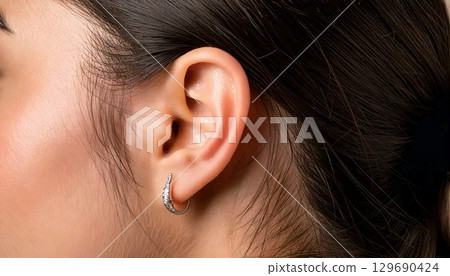 Beautiful female ears 129690424