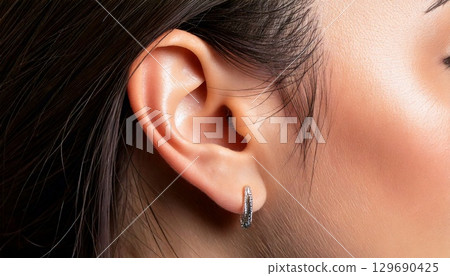 Beautiful female ears 129690425