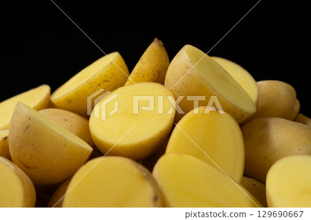 Fresh Raw Potatoes Cut In Half Close-Up Macro View. 129690667