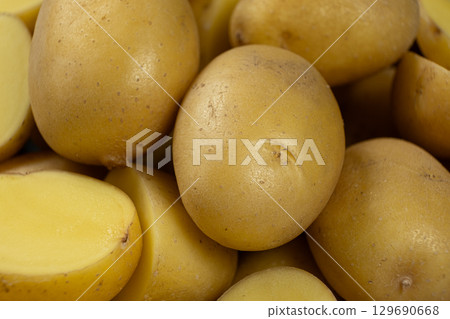 Fresh raw unpeeled potatoes close-up 129690668