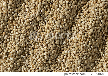 Uncooked White Quinoa Macro Top View. Natural Grain Background Uncooked White Quinoa Macro Top View. Natural Grain Background 129690685
