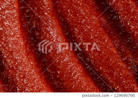 Smooth Surface of Tomato Concentrate Close-Up. Food Ingredient Detail 129690700