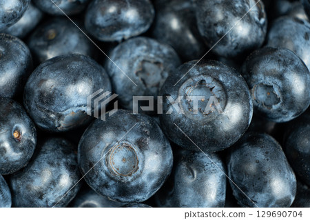 Whole Fresh Blueberries in Pile. Juicy Summer Fruit Texture 129690704
