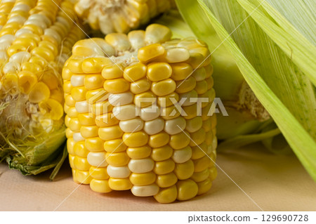 Detailed macro of fresh raw corn cobs Detailed macro of fresh raw corn cobs 129690728