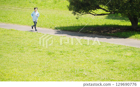 Young woman running sports image 129690776