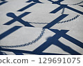 Shadow of the coastal chain pole 129691075