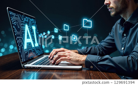 Man working with AI laptop 129691394
