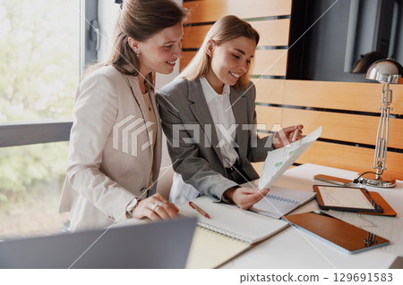 Engaging in a Collaborative Business Meeting within a Modern and Innovative Office Setting 129691583