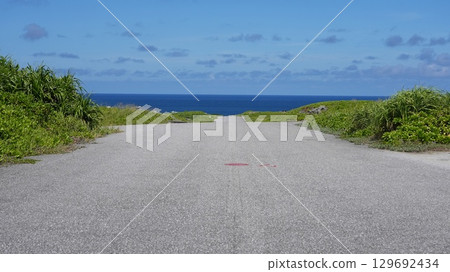 A view of Shiratorizaki, Miyako Island, where a single road stretches out towards the sea 129692434