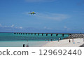 A plane approaching 17END with the blue sea and sky in the background 129692440