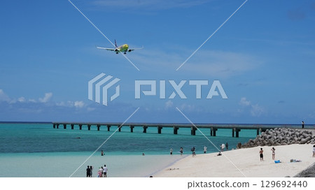 A plane approaching 17END with the blue sea and sky in the background 129692440