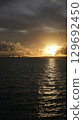 The sunset that colors the sky and sea of Miyakojima The silhouette of Irabu Bridge 129692450