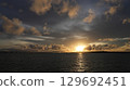 The sunset that colors the sky and sea of Miyakojima The silhouette of Irabu Bridge 129692451