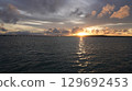 The sunset that colors the sky and sea of Miyakojima The silhouette of Irabu Bridge 129692453