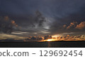 The sunset that colors the sky and sea of Miyakojima The silhouette of Irabu Bridge 129692454