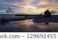 The sunset that colors the sky and sea of Miyakojima The silhouette of Irabu Bridge 129692455