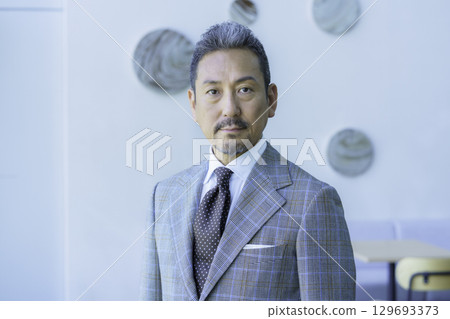 Upper body portrait of a middle-aged man wearing a suit. Photo courtesy of Sky Perfect Tokyo Media Center. Upper body portrait of a middle-aged man wearing a suit. Photo courtesy of Sky Perfect Tokyo Media Center. 129693373