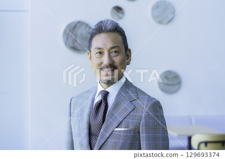 Upper body portrait of a middle-aged man wearing a suit. Photo courtesy of Sky Perfect Tokyo Media Center. Upper body portrait of a middle-aged man wearing a suit. Photo courtesy of Sky Perfect Tokyo Media Center. 129693374