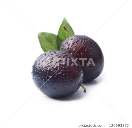 Sweet plums fruits with water drops on white backgrounds Sweet plums fruits with water drops on white backgrounds 129693872