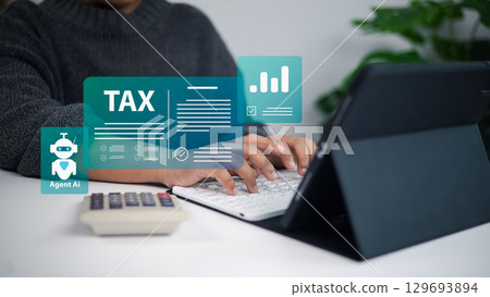 Financial technology, tax management, automation, and online accounting solutions. Hands typing on tablet keyboard with AI agent and digital tax icons. Financial technology, tax management, automation, and online accounting solutions. Hands typing on tablet keyboard with AI agent and digital tax icons. 129693894