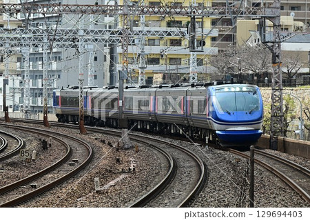 The Super Hakuto express train runs through the famous Motomachi curve on the quadruple-track Tokaido Main Line The Super Hakuto express train runs through the famous Motomachi curve on the quadruple-track Tokaido Main Line 129694403