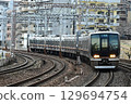 A commuter train arriving at Motomachi Station on the quadruple-track Tokaido Main Line 129694754